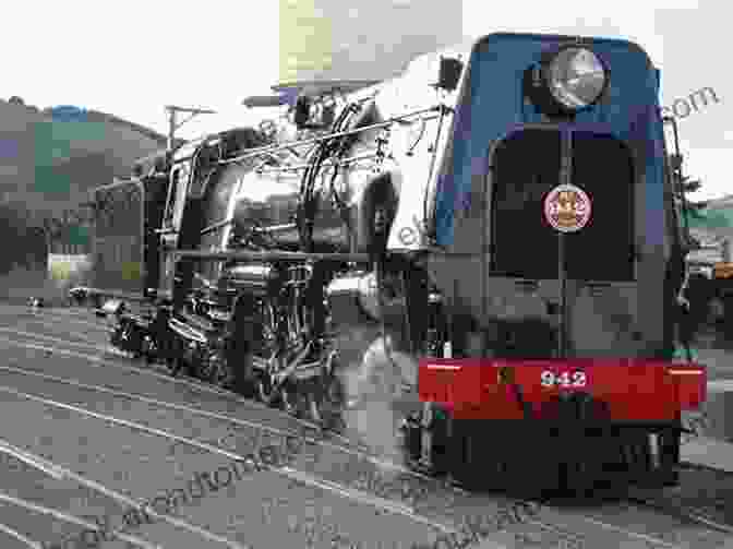 A Majestic Steam Locomotive Powering Through A Picturesque Landscape, Symbolizing The Golden Age Of Rail Travel. Southern Railway Gallery: A Pictorial Journey Through Time