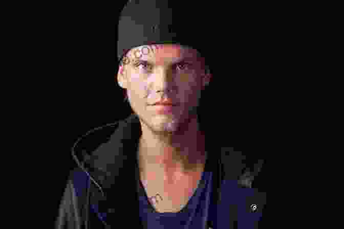 Tim: The Official Biography Of Avicii | Avicii's Silhouette In A Hoodie Against A Sunset Backdrop, Capturing His Enigmatic Aura Tim The Official Biography Of Avicii